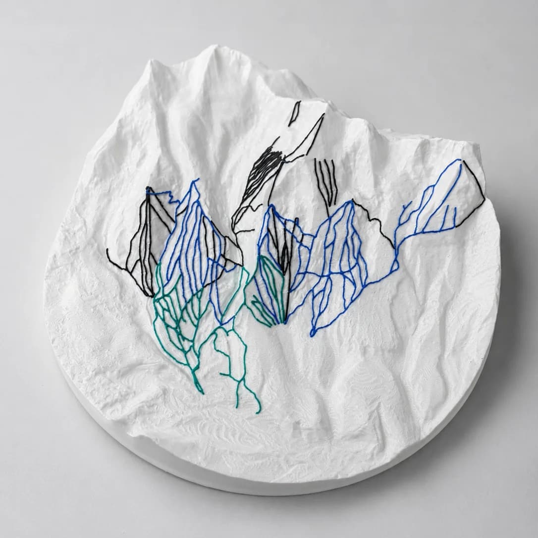 MONTE 3D topographic trail map — white relief with green, blue, and black ski trails